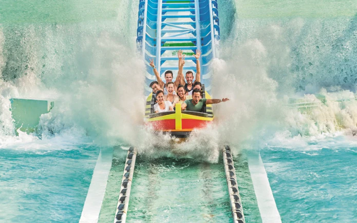 Tourists enjoying a water coaster ride at Adventure Waterpark Desaru.