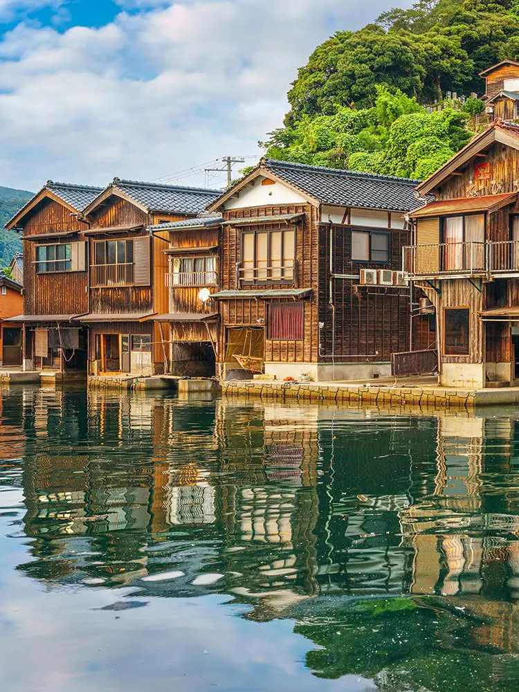 Ine Funaya waterfront boathouses reflecting on water, Kyoto Coastal Tour.