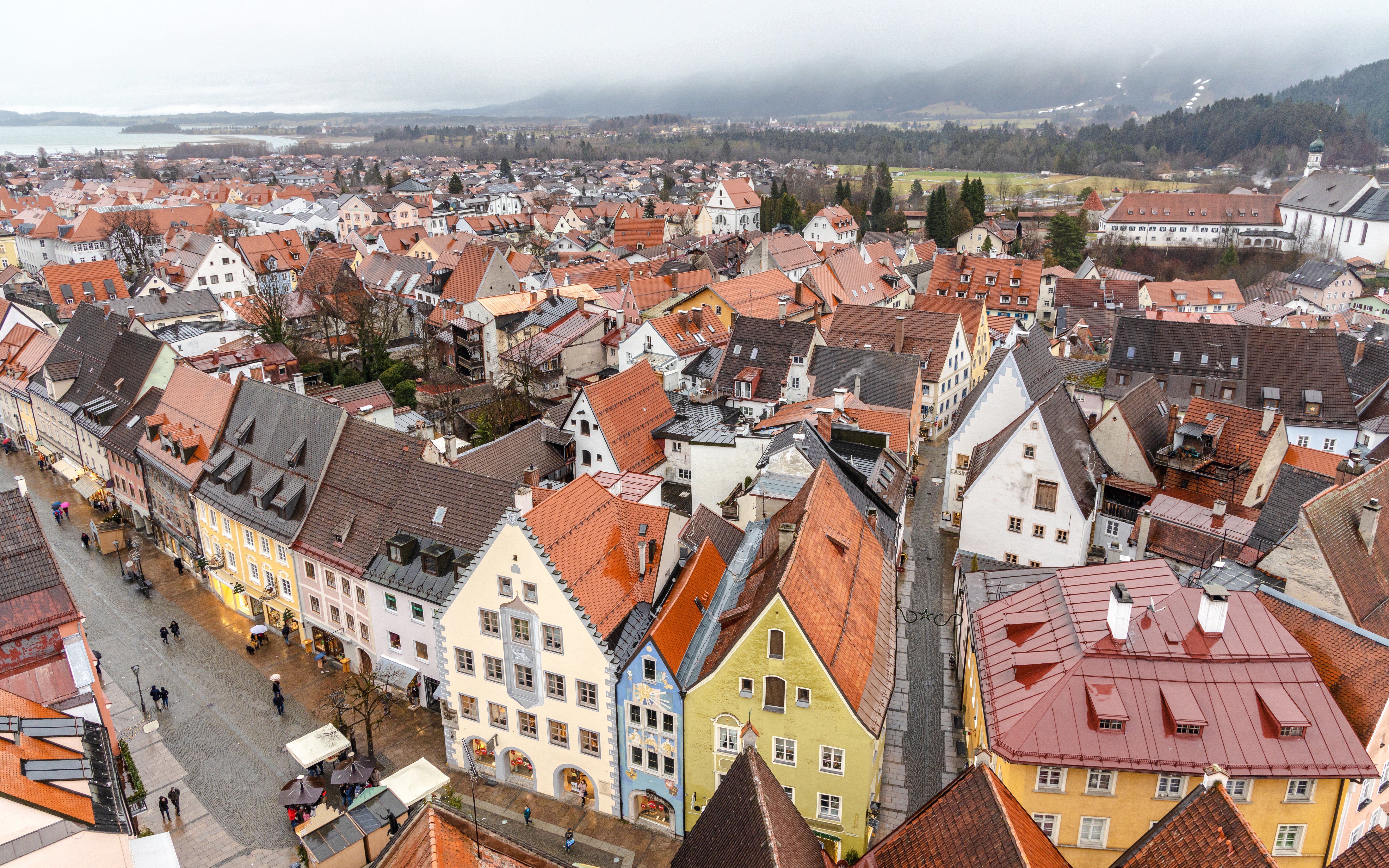 Aerial view of colorful historic buildings in Füssen, Germany, near the Füssen Heritage Museum.