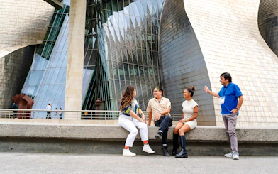 Visitors at Guggenheim Museum Bilbao during private tour from San Sebastian.