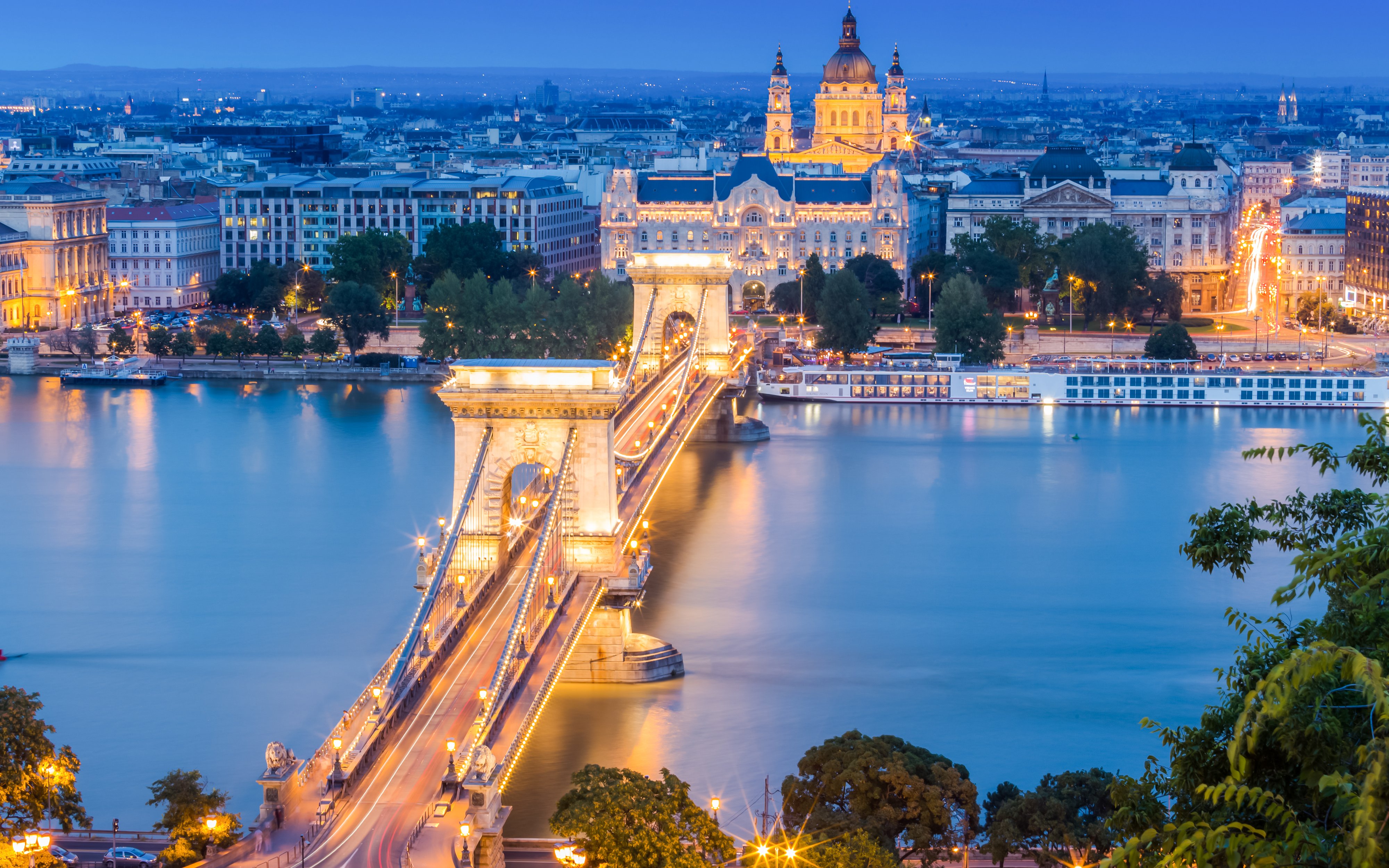 Chain Bridge and St. Stephen's Basilica illuminated at night, Budapest, Danube Cruise Christmas.