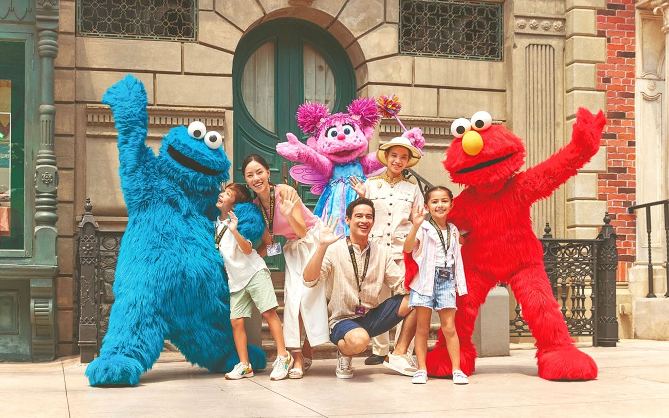 Visitors posing with characters at Universal Studios Singapore VIP Experience.