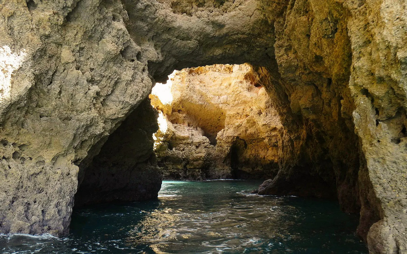 Rocky cave formations at Ponta da Piedade, Lagos, viewed from a boat tour.