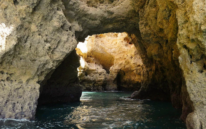 Rocky cave formations at Ponta da Piedade, Lagos, viewed from a boat tour.