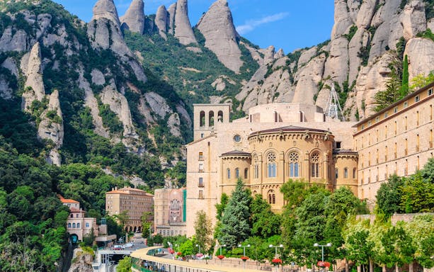 Montserrat Monastery in Catalonia's mountains, highlighting historic architecture.