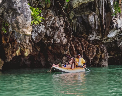 Kayaking through caves at Hong Island, Thailand.