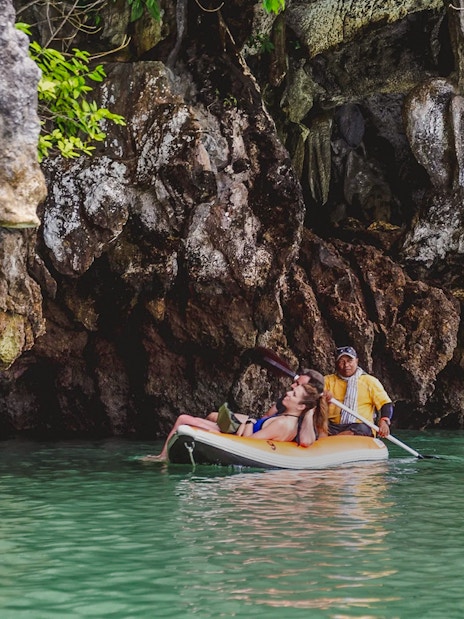 Kayaking through caves at Hong Island, Thailand.