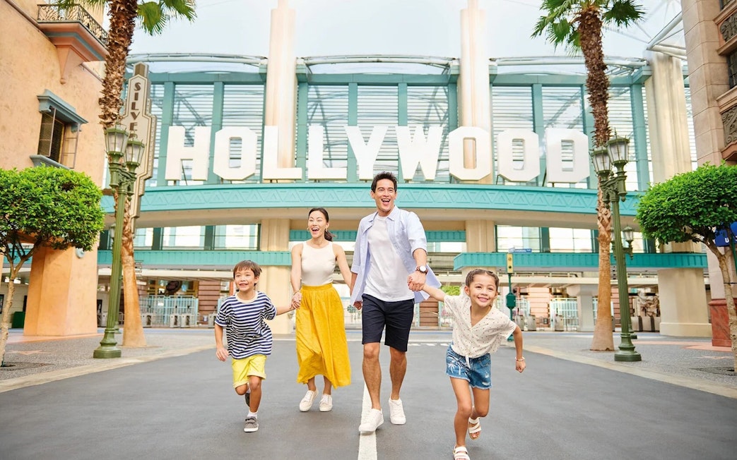 Family enjoying a day at Universal Studios Singapore's Hollywood zone.