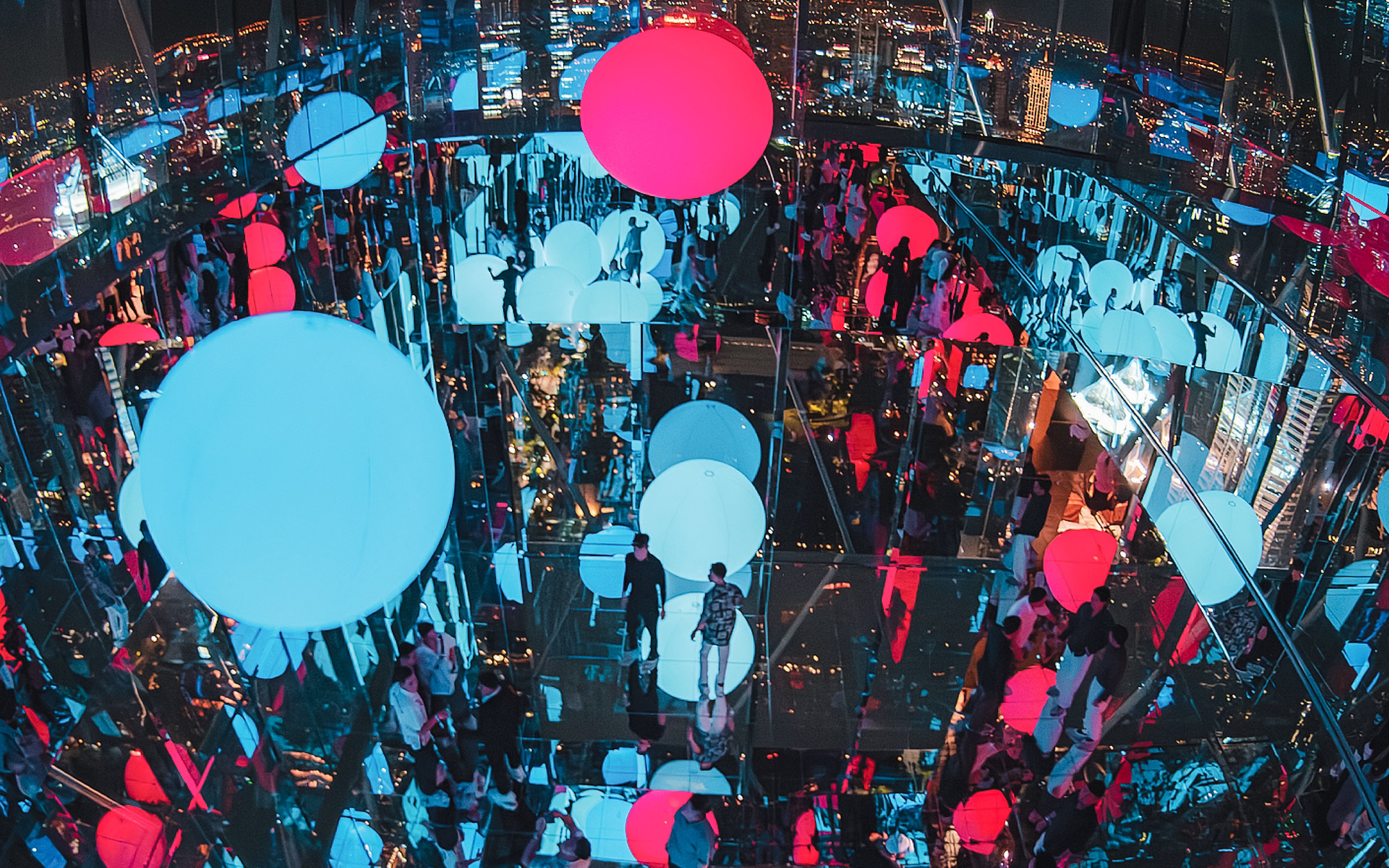 Akara Sky Hanuman observatory in Bangkok with mirror deck and floating light orbs.