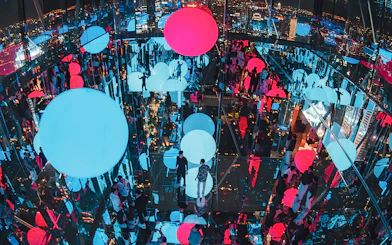 Akara Sky Hanuman observatory in Bangkok with mirror deck and floating light orbs.