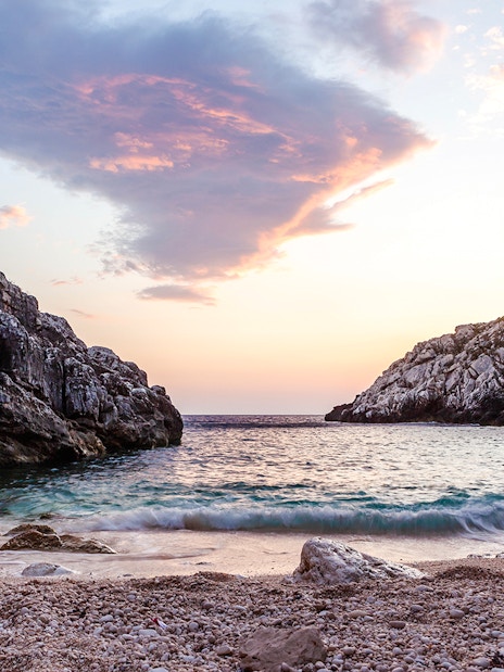 Rocky coastline at sunset on the Karaburun Peninsula, Albania.