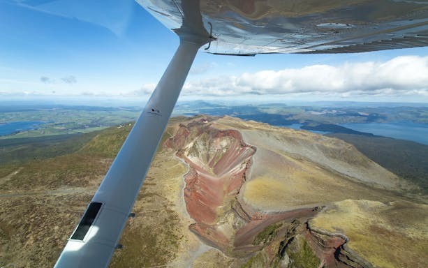 Floatplane view of Mount Tarawera's crater and surrounding landscape, New Zealand.