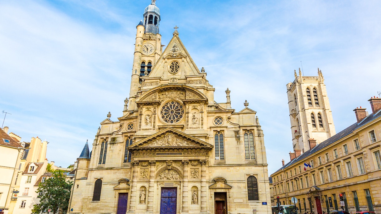 Saint-Étienne-du-Mont church facade in Paris with intricate architecture.