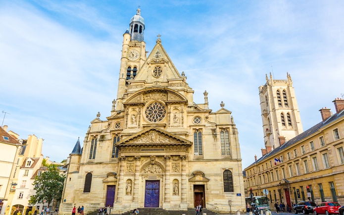 Saint-Étienne-du-Mont church facade in Paris with intricate architecture.