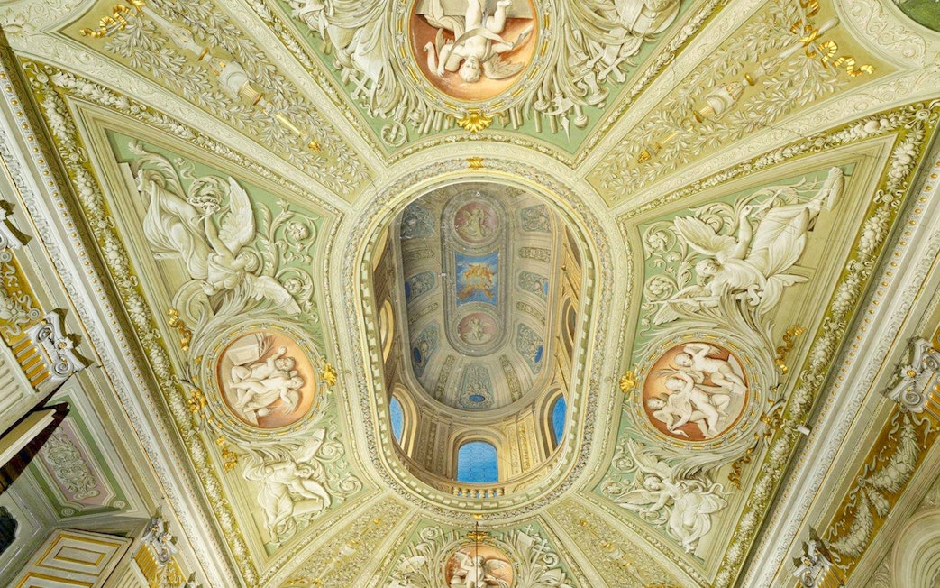 Doria Pamphilj Gallery ornate ceiling with frescoes and intricate carvings.