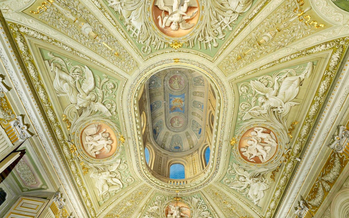 Doria Pamphilj Gallery ornate ceiling with frescoes and intricate carvings.
