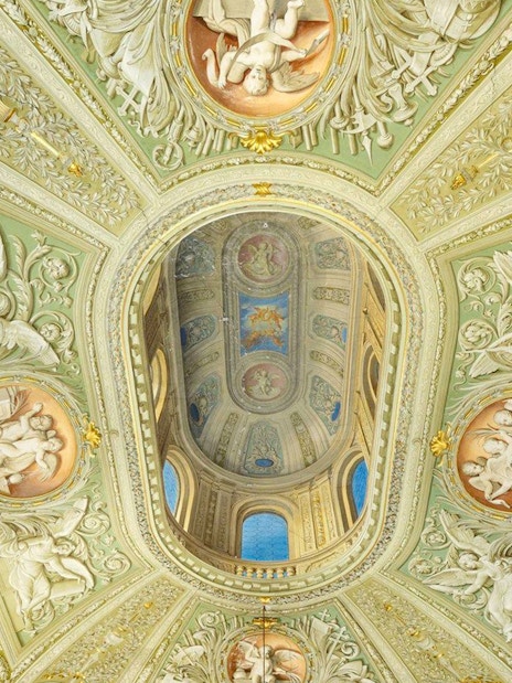 Doria Pamphilj Gallery ornate ceiling with frescoes and intricate carvings.