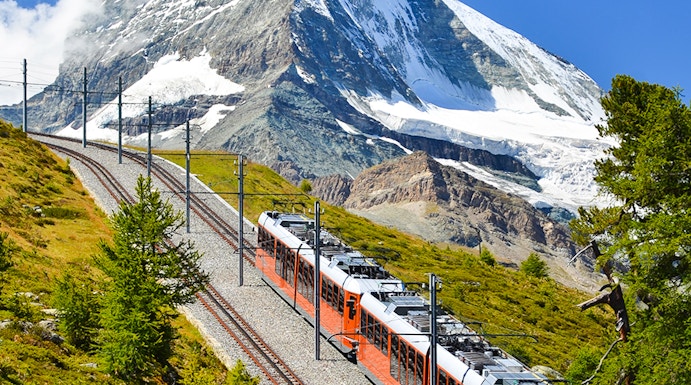 Gornergrat train traveling with Matterhorn in the background, Zermatt, Switzerland.