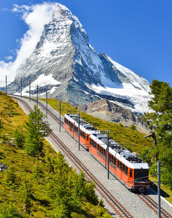 Gornergrat train traveling with Matterhorn in the background, Zermatt, Switzerland.