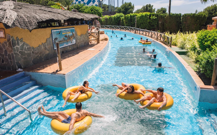 Visitors enjoying the lazy river at Aqualandia Benidorm, Spain.