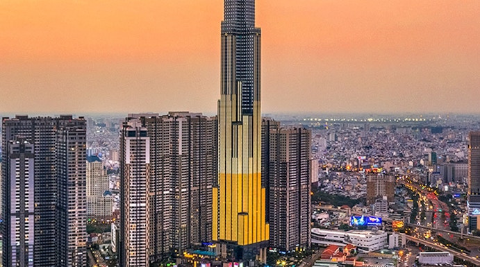 Aerial view of Landmark 81 in Ho Chi Minh City at sunset.
