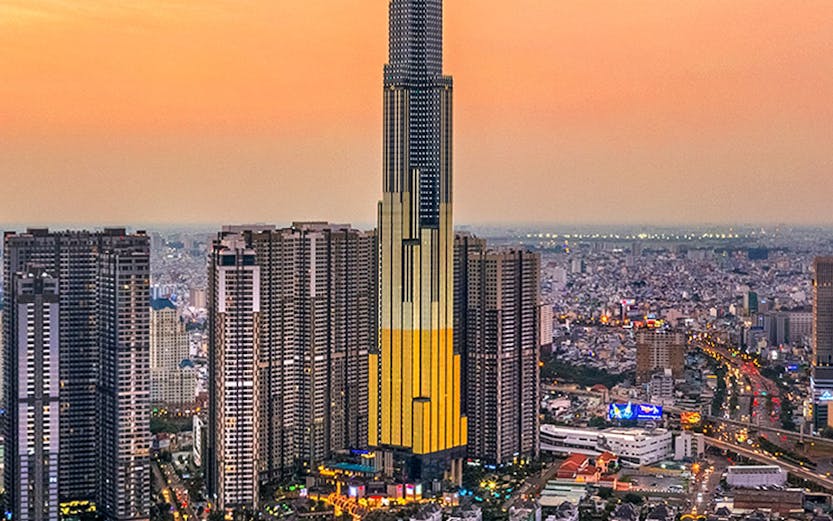 Aerial view of Landmark 81 in Ho Chi Minh City at sunset.
