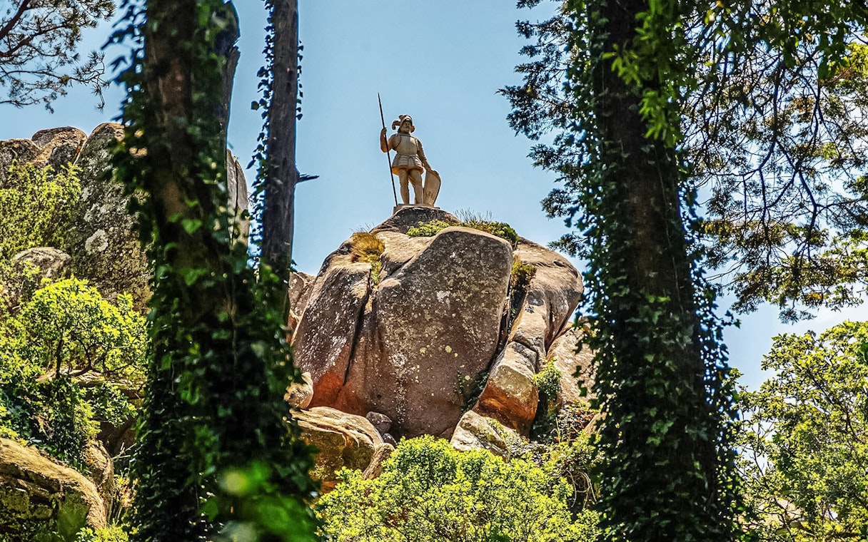 Statue of a warrior on a rock at Pena Palace Park, Sintra, Portugal.