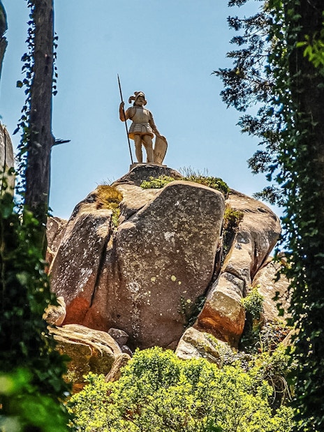 Statue of a warrior on a rock at Pena Palace Park, Sintra, Portugal.