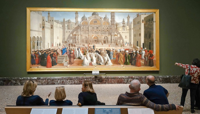 People admire St. Mark Preaching in Alexandria while exploring the Pinacoteca di Brera museum in Milan.