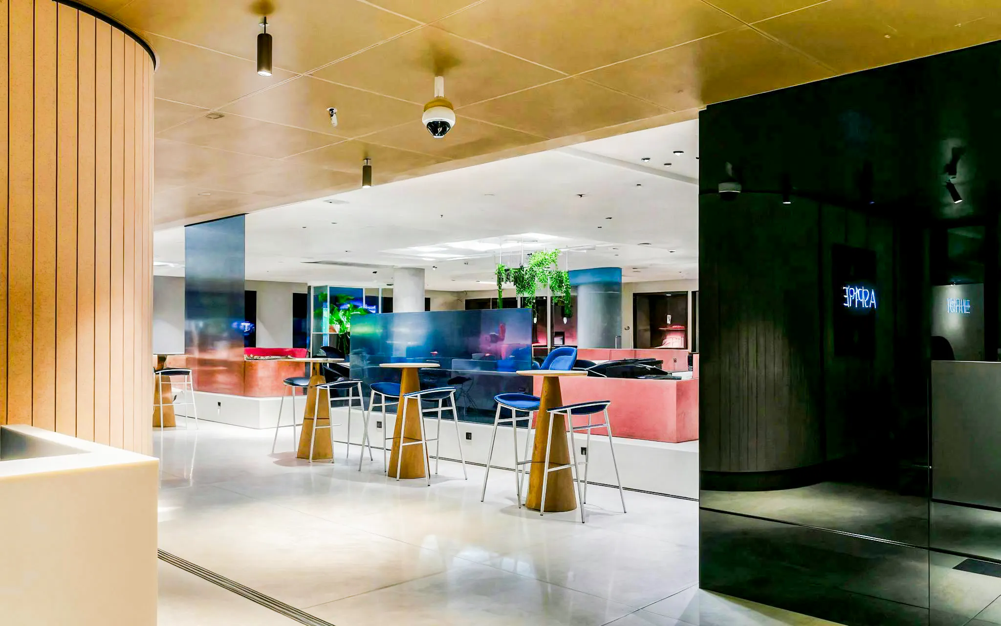 Aspire Lounge No.26 at Schiphol Airport with modern seating and ambient lighting.