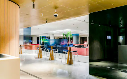 Aspire Lounge No.26 at Schiphol Airport with modern seating and ambient lighting.