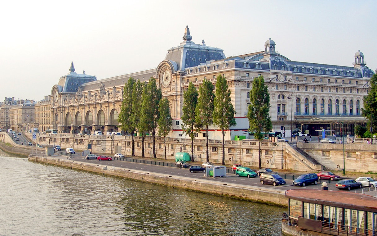 Facade of Musée d'Orsay along the Seine River in Paris, France.