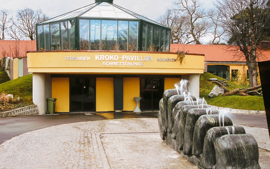 Entrance to the Crocodile Pavilion at Schönbrunn Zoo, Vienna, with a stone fountain.