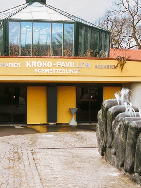 Entrance to the Crocodile Pavilion at Schönbrunn Zoo, Vienna, with a stone fountain.