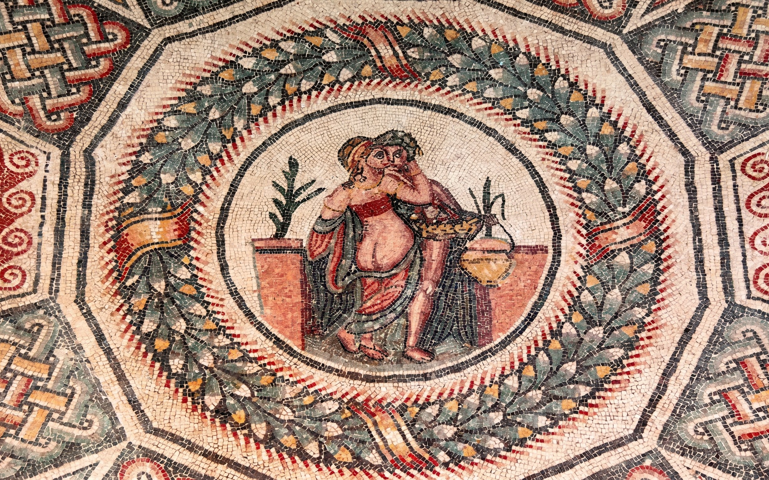 Ancient Roman mosaic depicting figures in Villa Romana del Casale, Piazza Armerina.