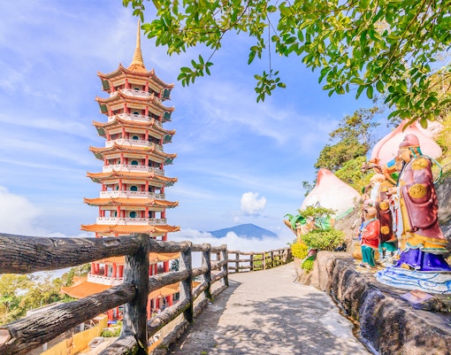 Chin Swee Caves Temple with intricate pagoda and lush forest backdrop in Genting Highlands, Malaysia.