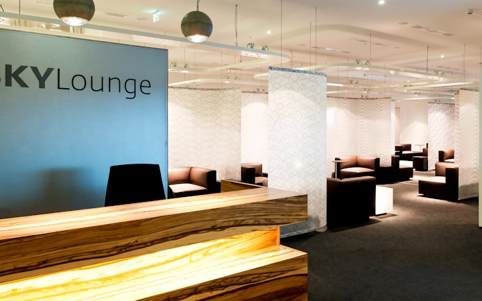 SKY Lounge seating area at Vienna Airport Terminal 3 with modern decor.