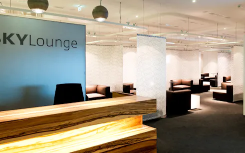 SKY Lounge seating area at Vienna Airport Terminal 3 with modern decor.