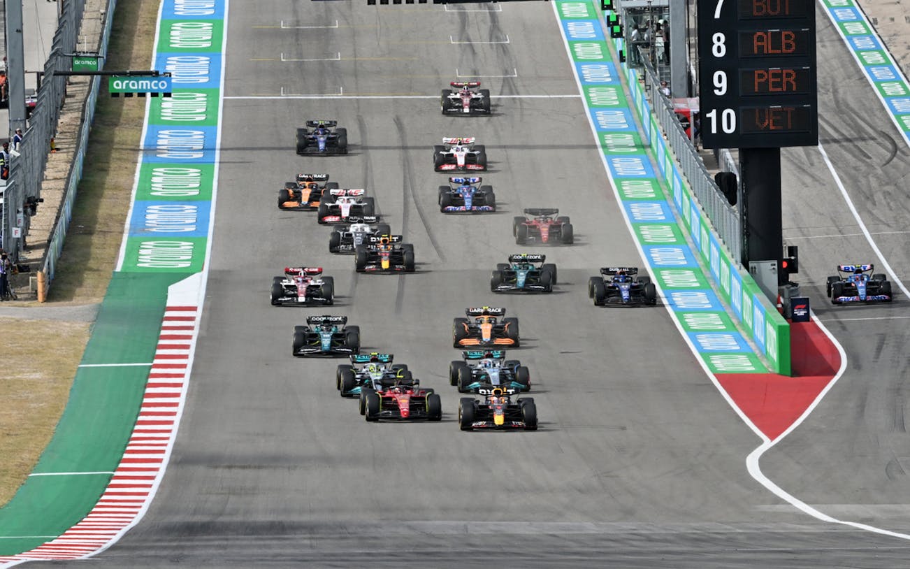 Formula 1 cars racing at the USA Grand Prix in Austin, Texas.