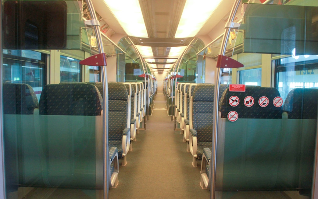 Interior of KLIA Ekspress train with rows of empty seats, Kuala Lumpur.