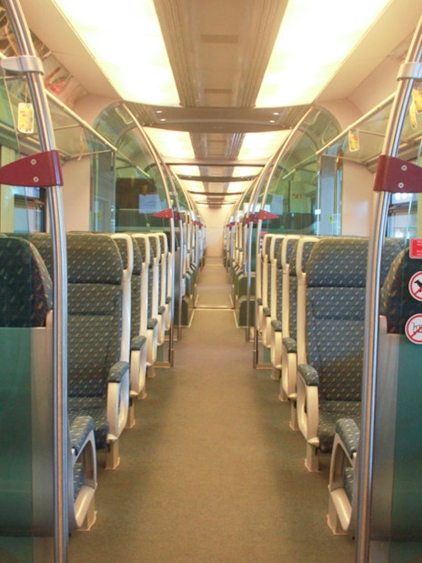 Interior of KLIA Ekspress train with rows of empty seats, Kuala Lumpur.
