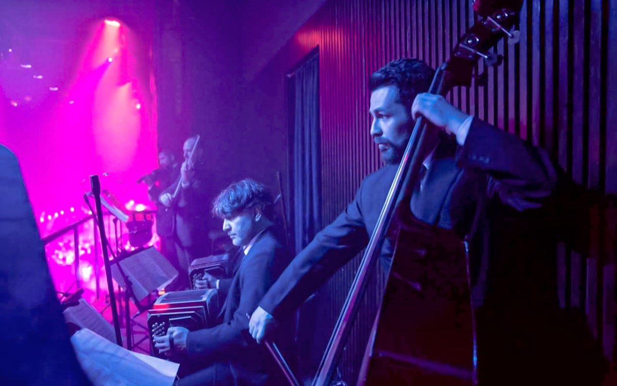Musicians performing at Madero Tango Show in Buenos Aires.