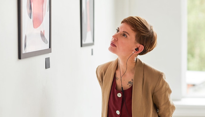 Visitor admiring artwork at Fondation Louis Vuitton, Paris.
