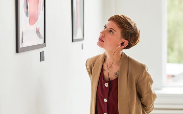 Visitor admiring artwork at Fondation Louis Vuitton, Paris.