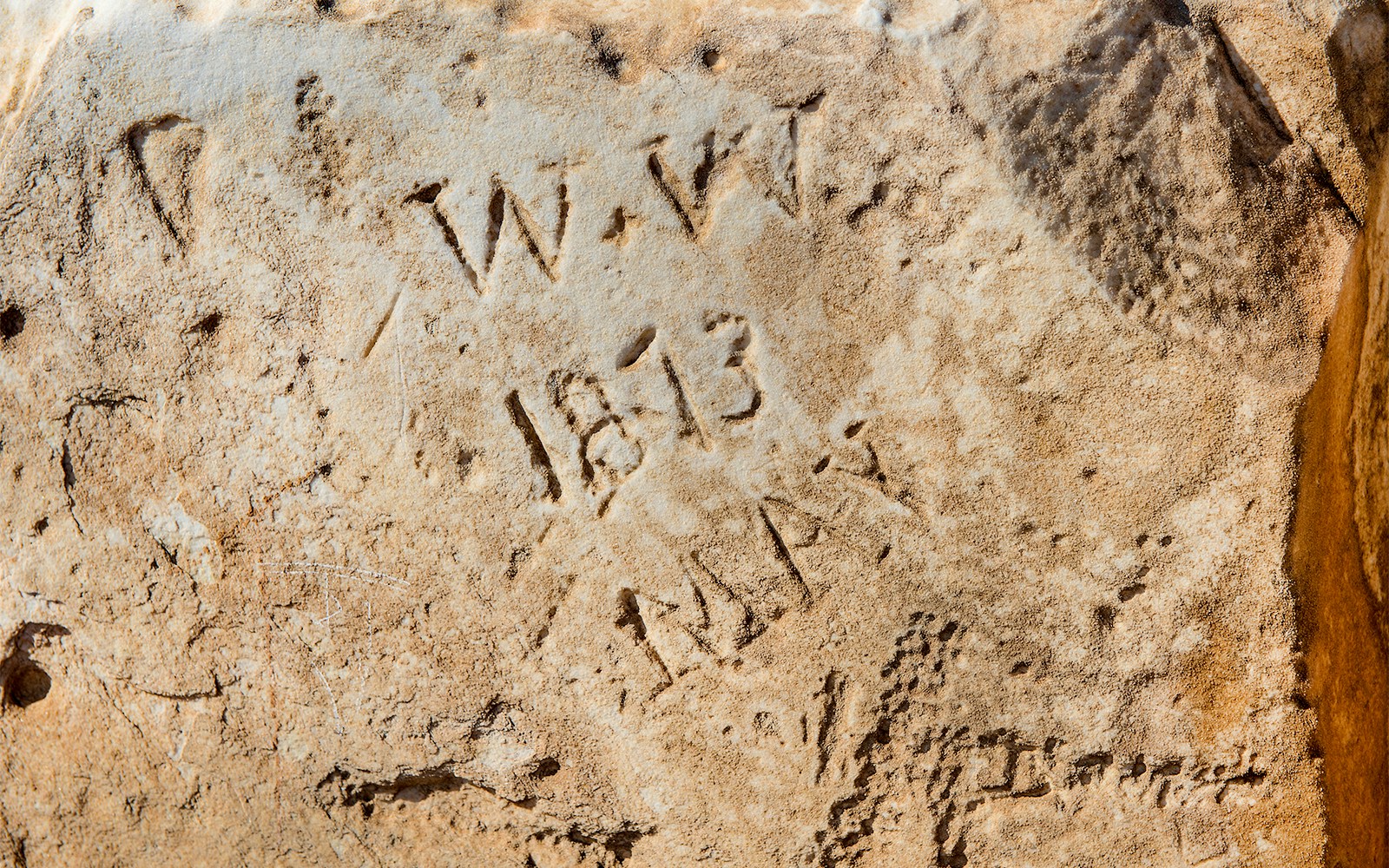 Marble inscriptions at Temple of Poseidon, Cape Sounion, with dates and initials.