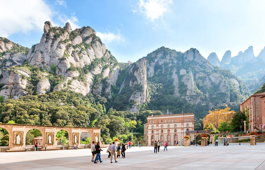 Montserrat Monastery with audio guide, showcasing the historic architecture and scenic mountain backdrop.
