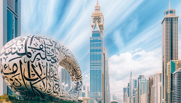 Museum of the Future in Dubai with surrounding skyscrapers.