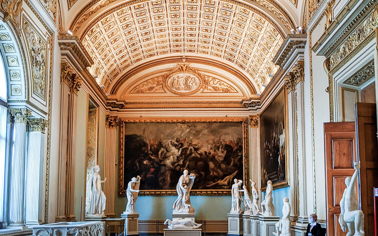 Palazzo Vecchio interior with classical statues and ornate ceiling, Florence.