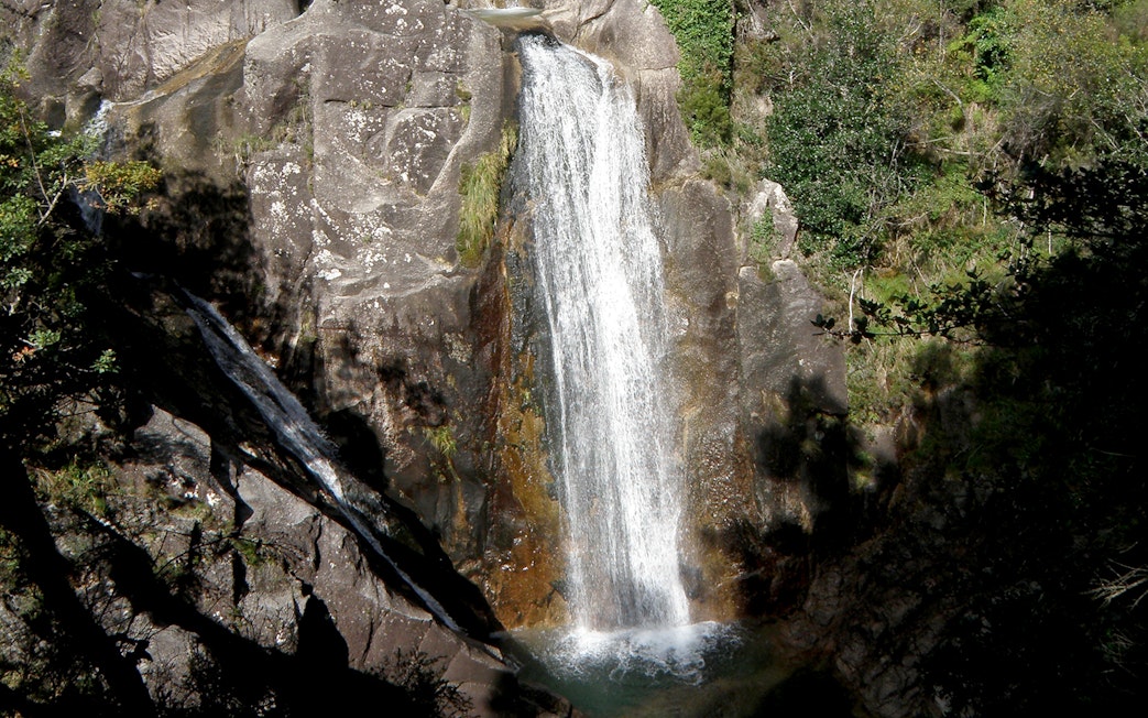 Waterfall cascading over rocks in Peneda Gerês National Park, Portugal.