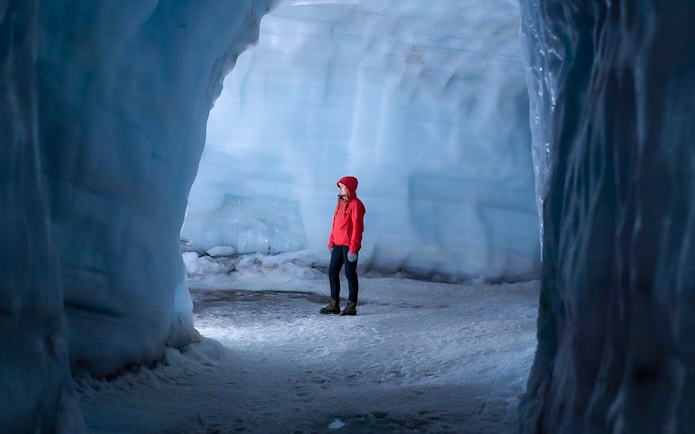 Guest exploring Langjokull ice tunnel in Iceland.